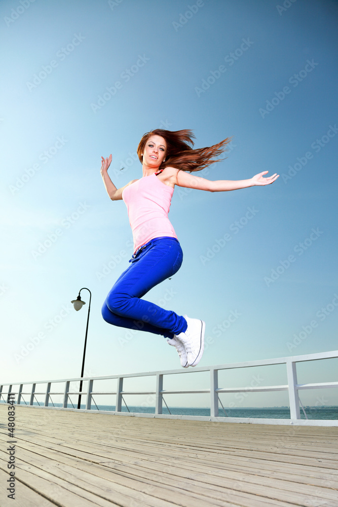Attractive girl Young woman jumping sky Attractive girl Young woman jumping sky