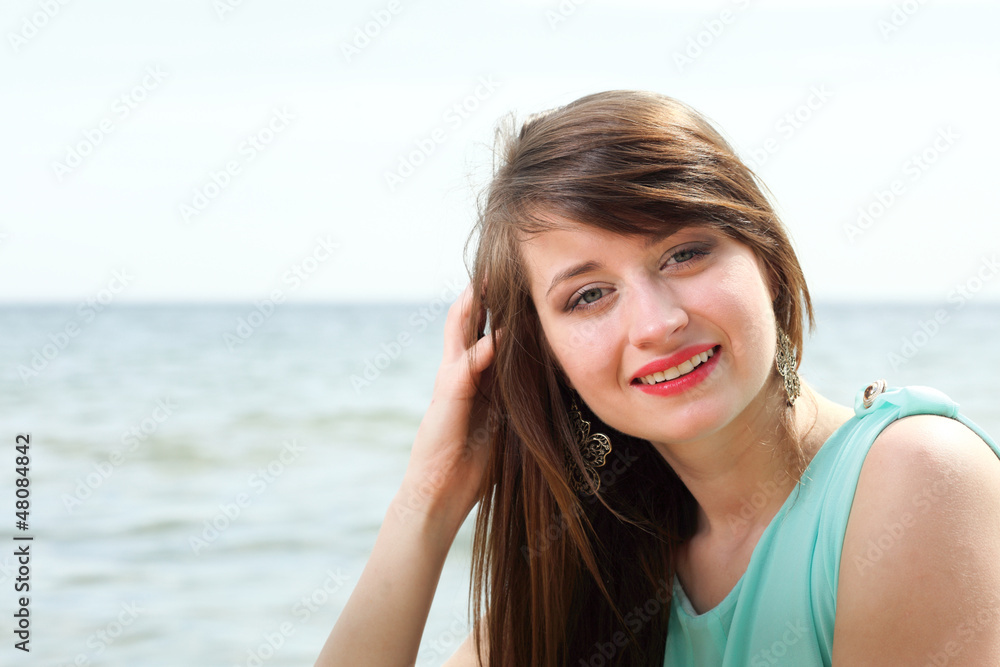 young beautiful woman portrait on the beach young beautiful woman portrait on the beach
