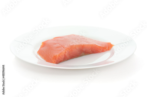 Trout steak on white plate