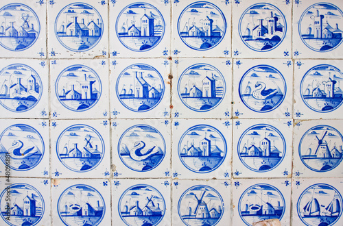 Antique dutch tiles on kitchen wall of old building