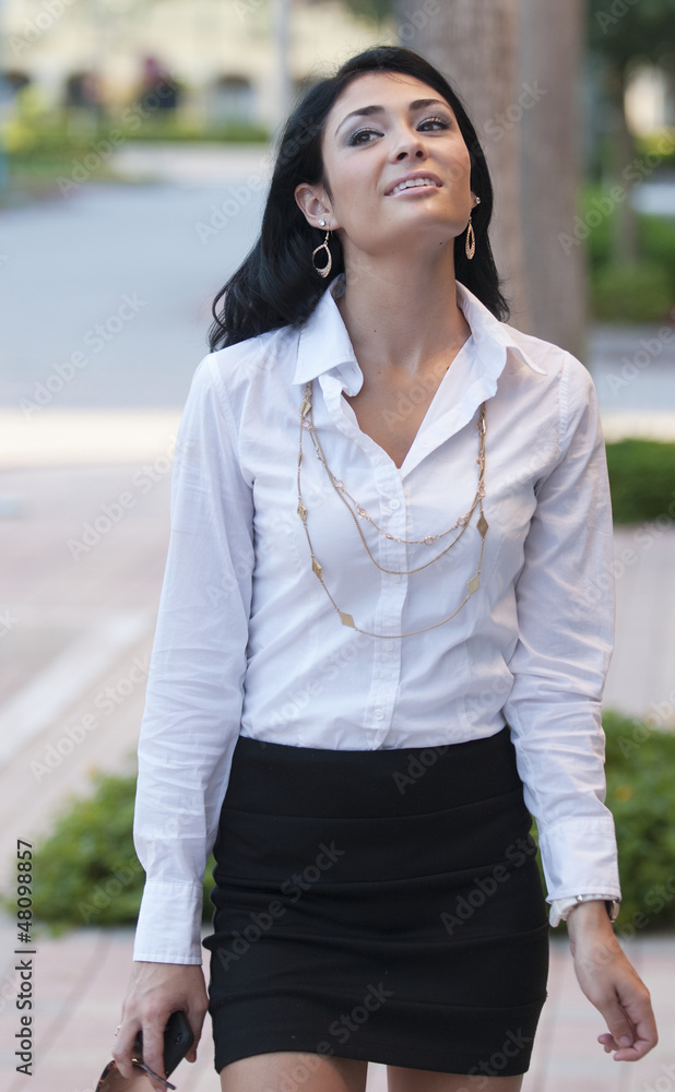 Beautiful woman in white shirt and black skirt. Beautiful woman in white shirt and black skirt.