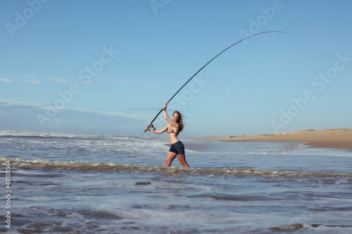 Bikini girl casting her rod