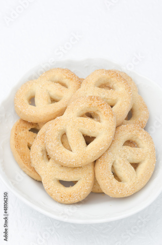 sugar cookies in a white bowl, top view