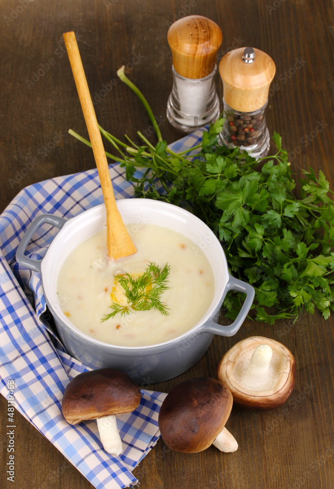 Mashed potatoes in saucepan with ingredients on wooden table Mashed potatoes in saucepan with ingredients on wooden table