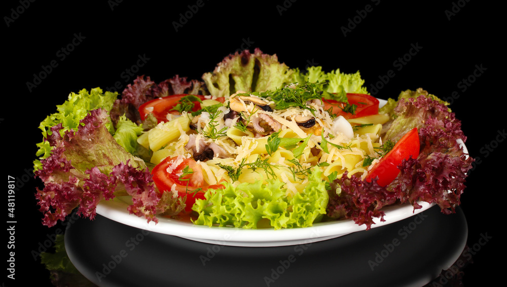 Tasty italian pasta with seafood isolated on black Tasty italian pasta with seafood isolated on black