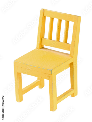 Yellow toy chair isolated on white