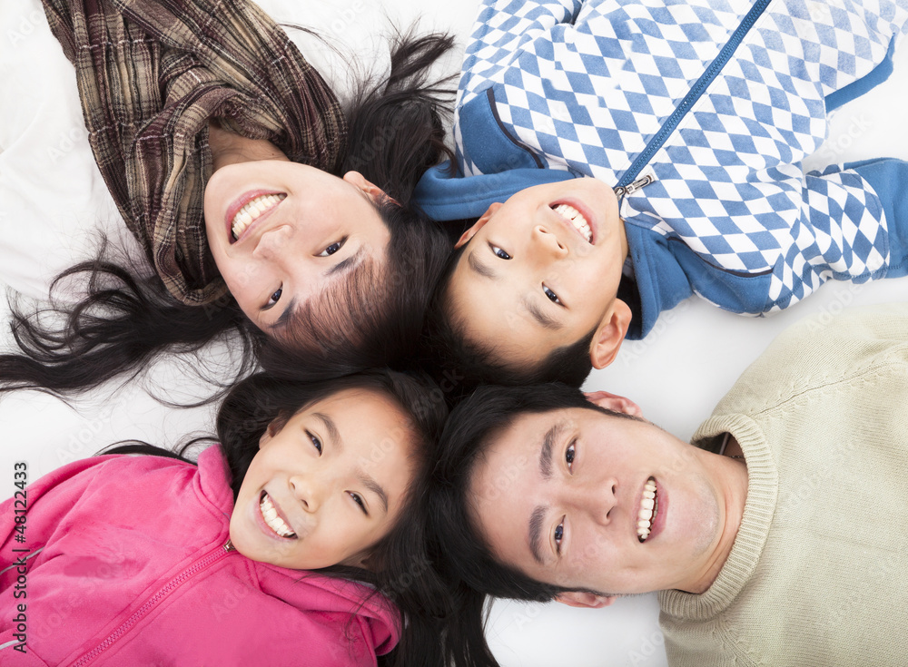 Happy asian  family with heads together