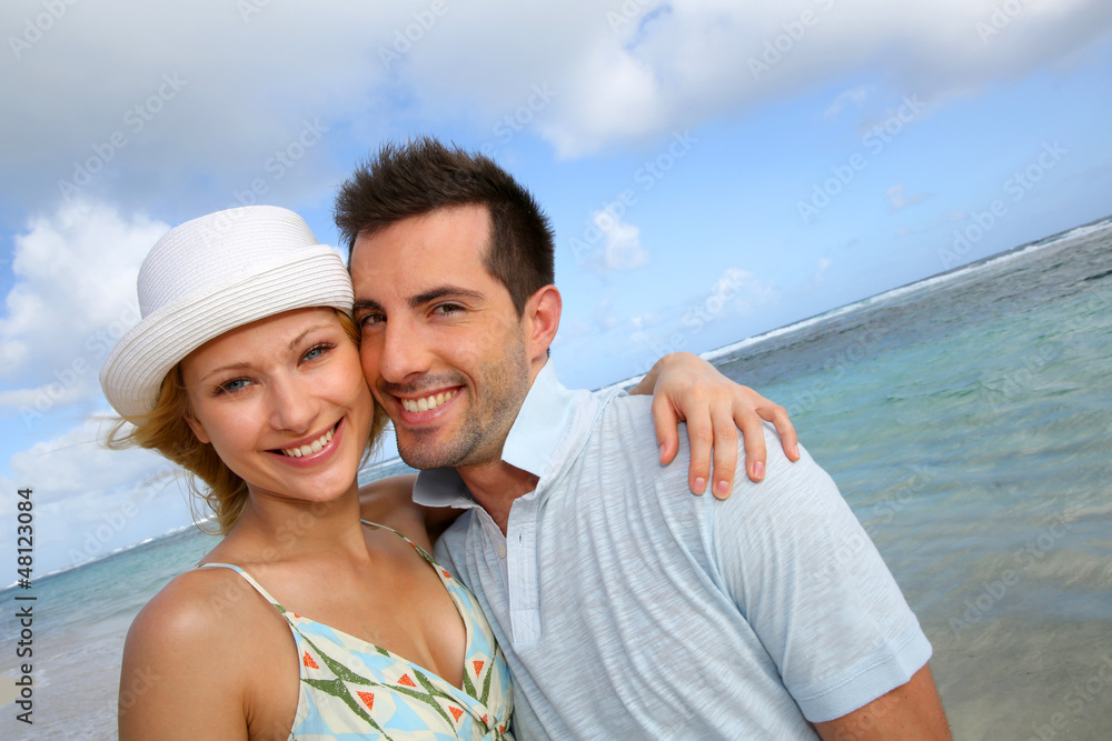 Portrait of cheerful couple at the beach Portrait of cheerful couple at the beach