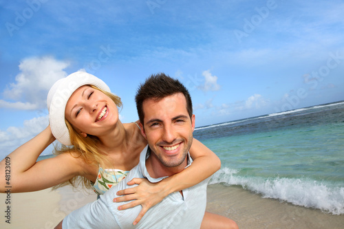 Cheerful couple enjoying vacation at the beach