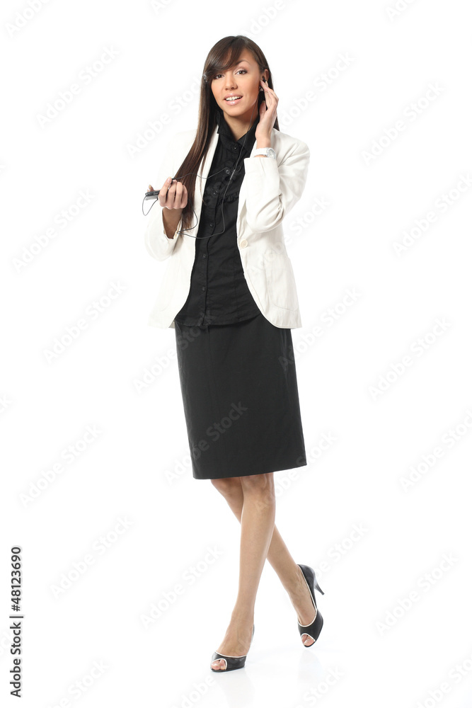 Beautiful girl in a business suit talking on a cell phone Beautiful girl in a business suit talking on a cell phone