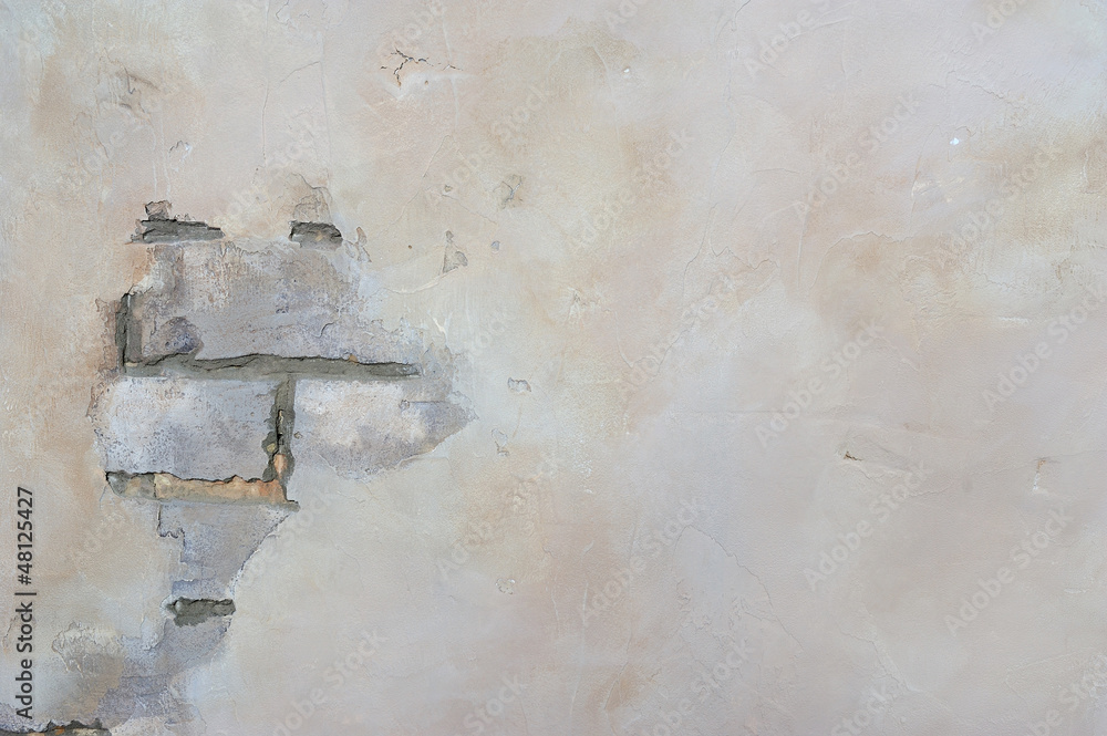 Brick wall with peeling plaster Brick wall with peeling plaster
