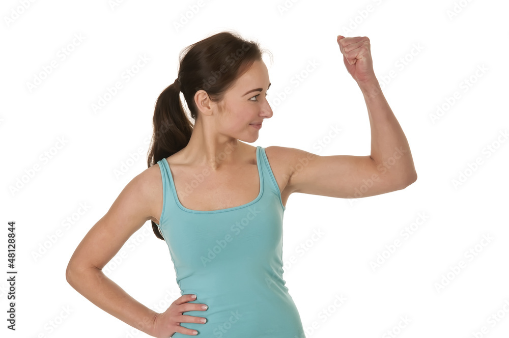 Fototapeta premium Frau zeigt Muskeln