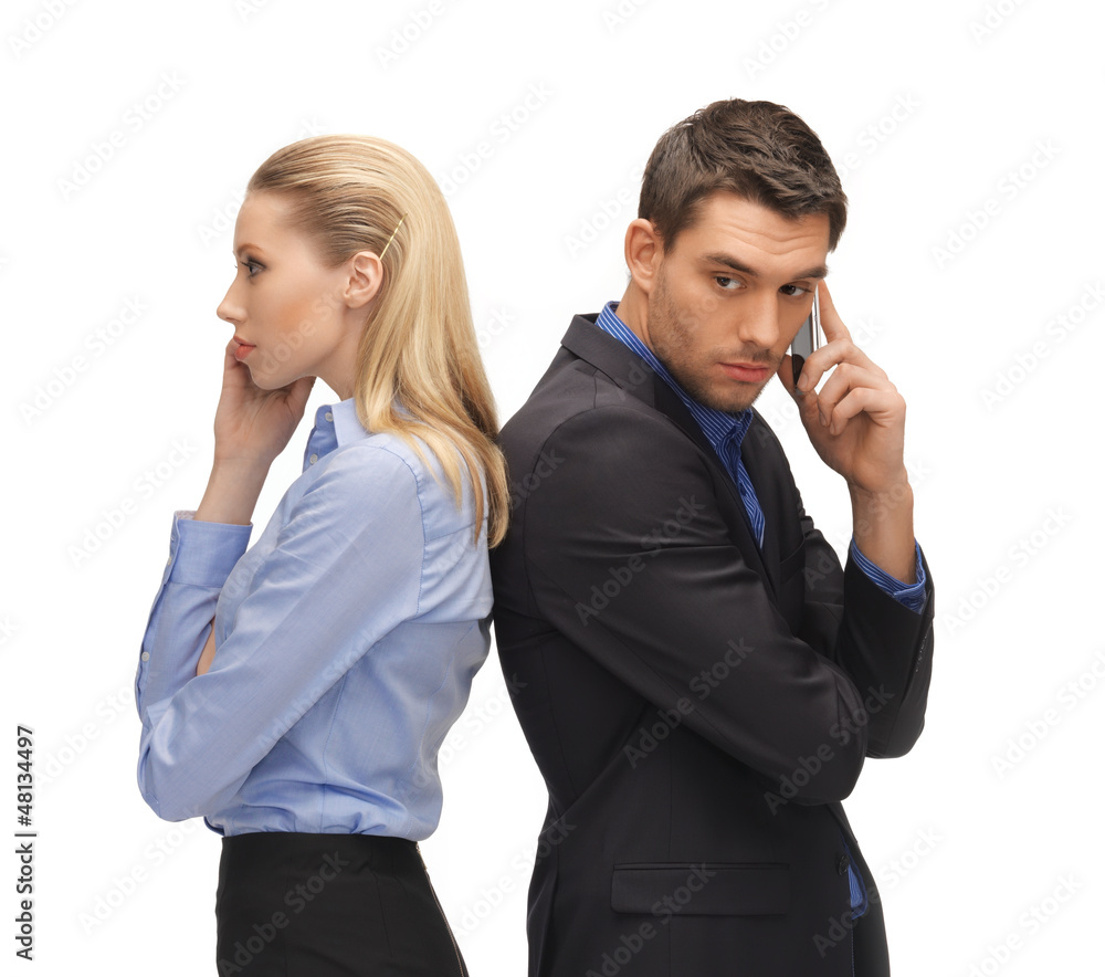 man and woman with cell phones man and woman with cell phones