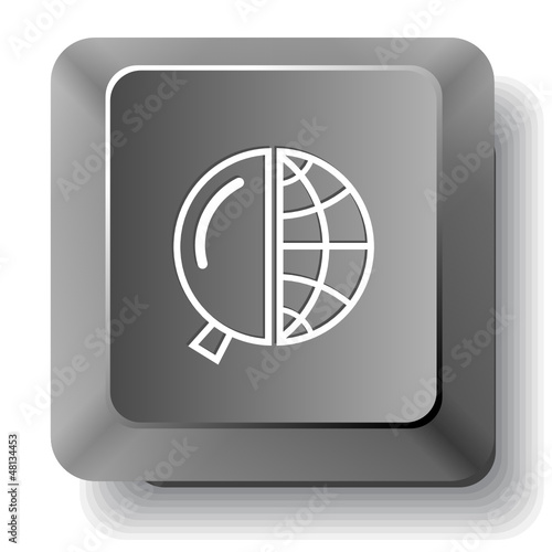 Globe and magnifying glass. Vector computer key.