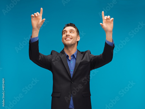 Obraz na plátně man in suit working with something imaginary