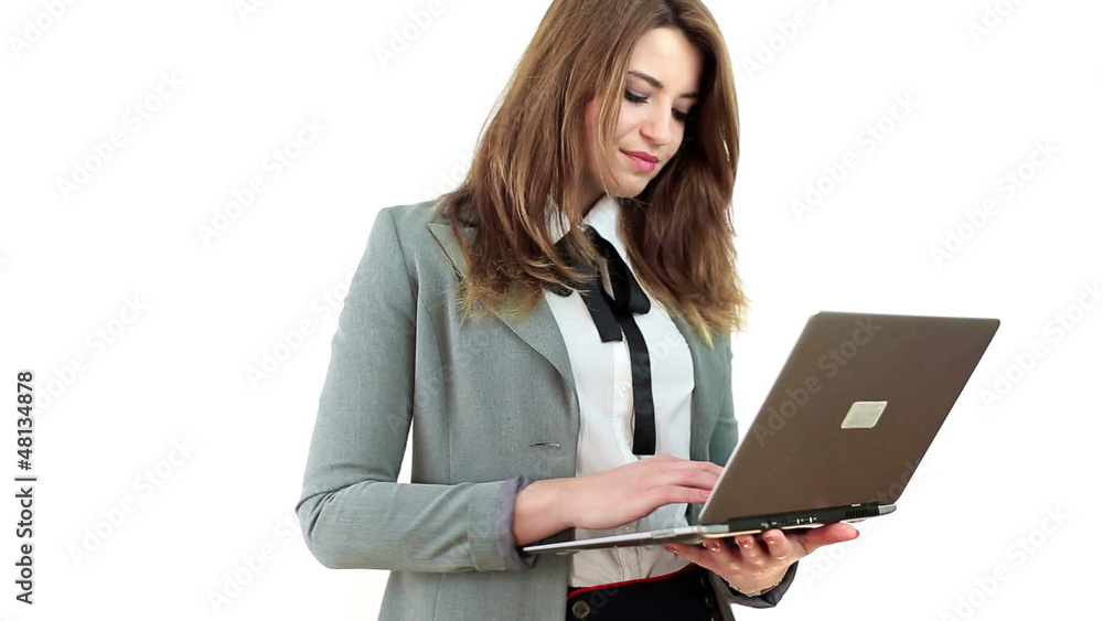 Young businesswoman working on laptop, isolated on white Young businesswoman working on laptop, isolated on white