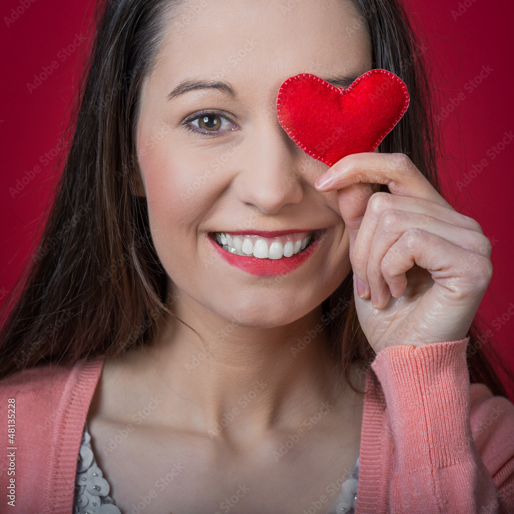 beautiful young woman holding red heart beautiful young woman holding red heart