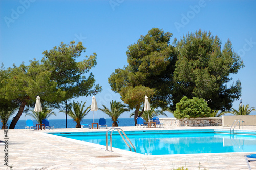 Swimming pool by a beach at the luxury hotel, Halkidiki, Greece