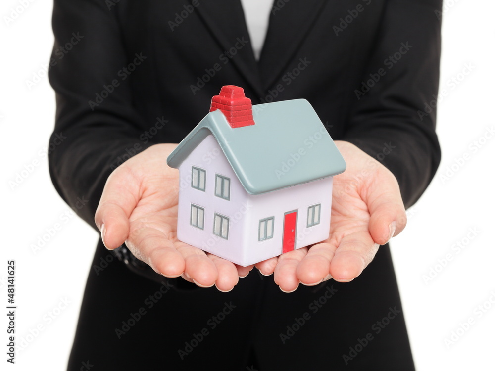 Real estate agent showing small house / home Real estate agent showing small house / home