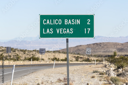 Las Vegas Road Sign with Las Vegas Valley in background