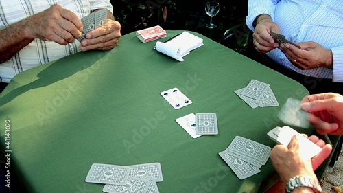 Old man man distributes cards