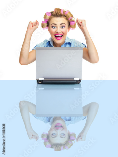 Successful funny smiling business woman with laptop photo