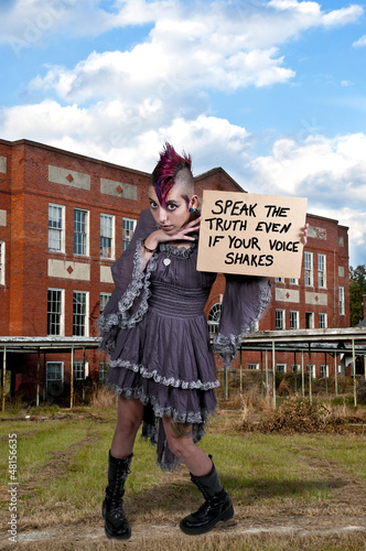 Woman Holding a Sign
