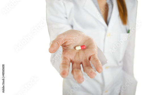 medical woman with pill in the hand