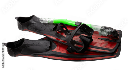 Mask, snorkel and flippers with water drops