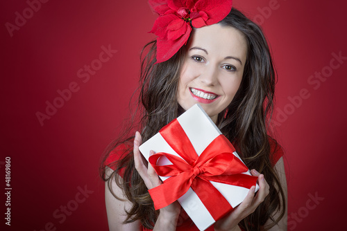 Young woman holding Gift box