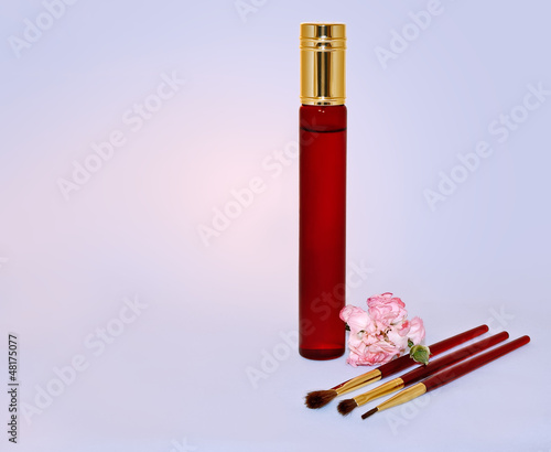 Perfume bottle and brushes for make-up