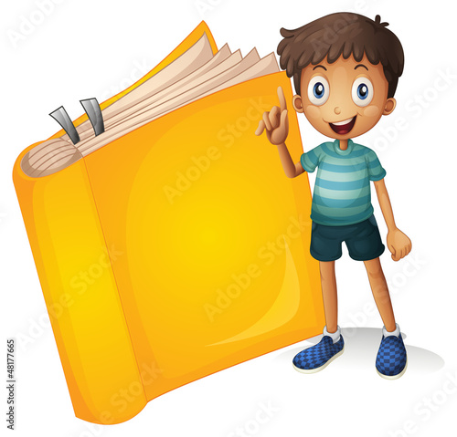 A smiling boy and a yellow book