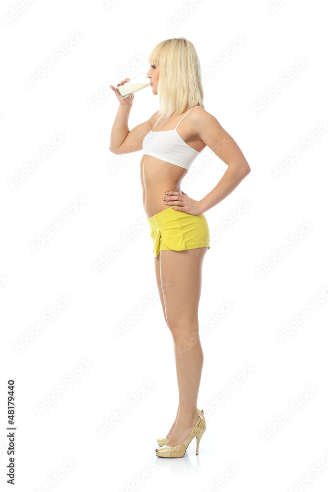 Attractive athletic girl drinks milk Attractive athletic girl drinks milk