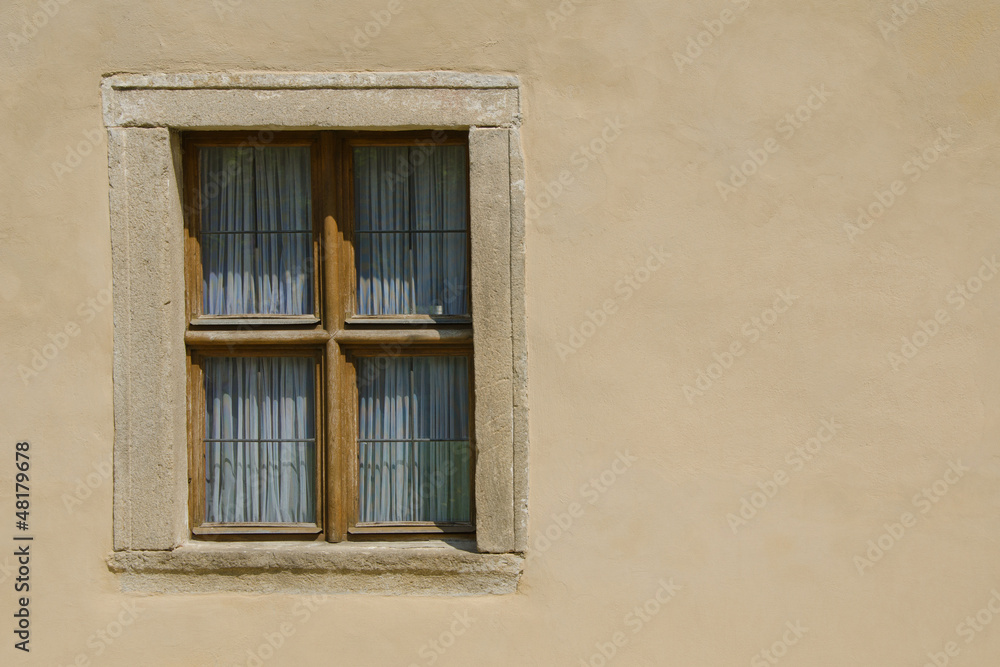 Wooden window in the wall of the castle