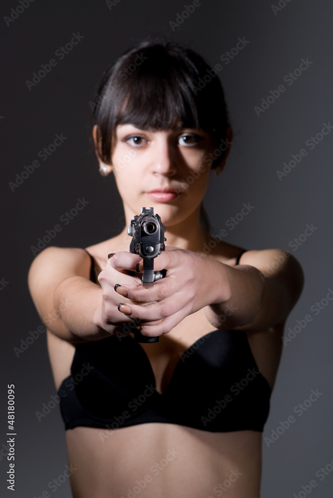 Beautiful sexual girl brunette with gun Beautiful sexual girl brunette with gun
