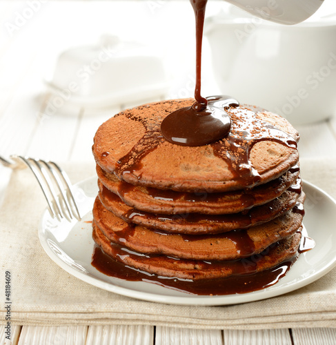 Chocolate pancakes with chocolate sauce