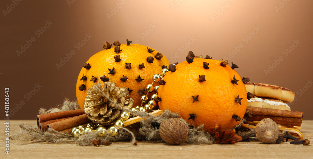 composition of christmas spices and tangarines, on wooden table
