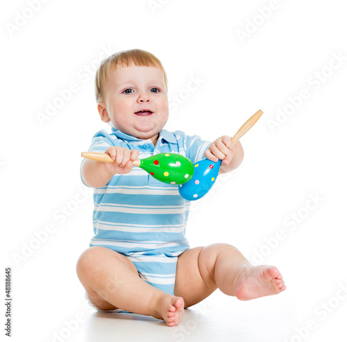 Baby  boy playing with musi...