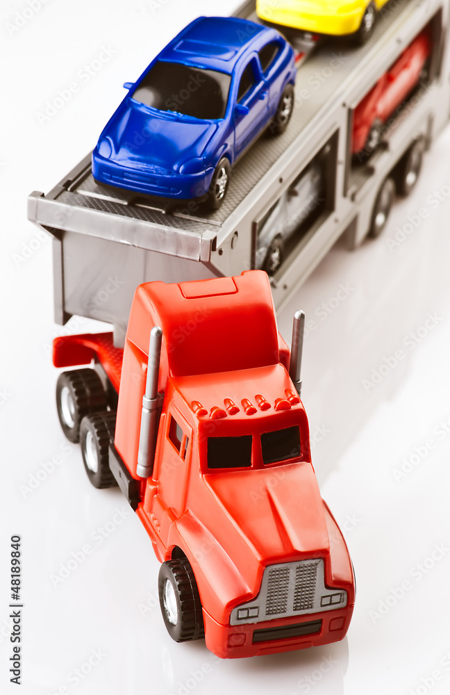 Toy cars transported on a truck plastic