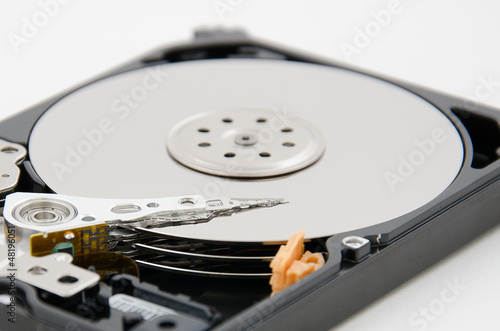 close up of hard disk plate and reader head