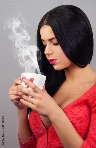 lovely lady behind a mug of warm drink