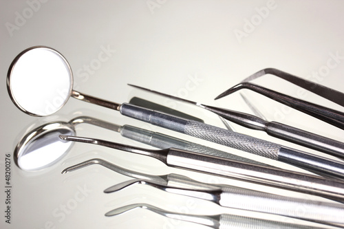 Set of dental tools for teeth care isolated on grey background