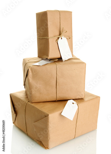 parcels boxes with kraft paper, isolated on white © Africa Studio