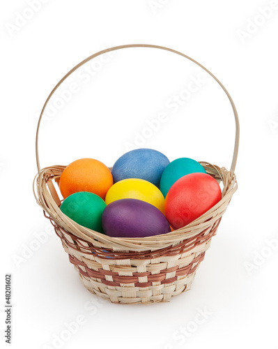 Colorful easter eggs in basket on white+ clipping path