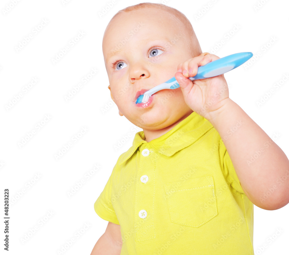 Image of little boy cleaning teeth isolated on white Image of little boy cleaning teeth isolated on white