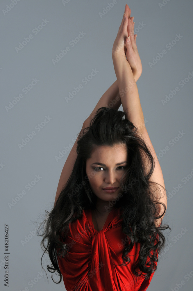 Portrait of sexy Asian brunette at grey background Portrait of sexy Asian brunette at grey background