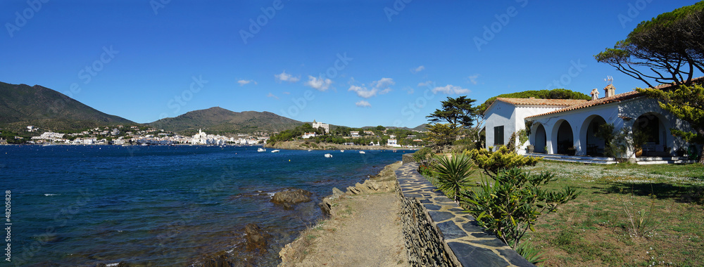 Panorama over the Mediterranean village of Cadaques with a waterfront house, Costa Brava, Catalonia, Spain