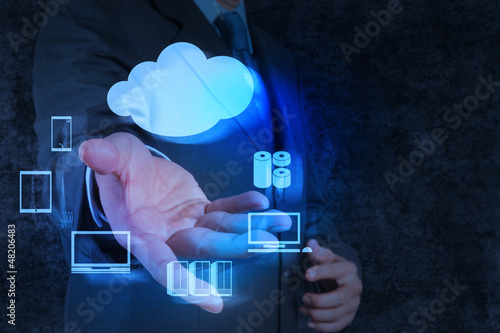Businessman hand shows a Cloud Computing diagram