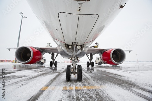 Undercarriage of the airplane in winter photo