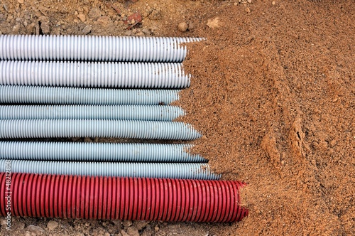 beam corrugated underground conduits covered with sand photo